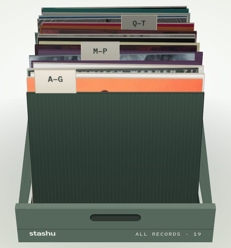 The crate view of a vinyl collection: LPs standing in a sage-green crate, filed behind divider cards marked A–G, M–P and Q–T. The front of the crate reads All records · 19.